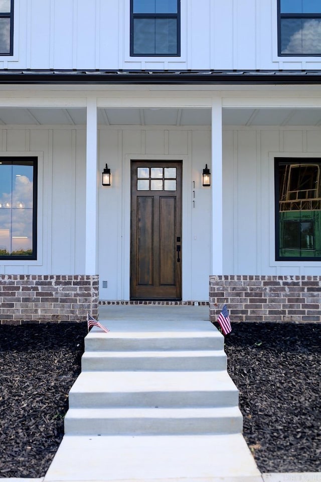 111 Legacy Way, Ward, AR 72176 - property entrance featuring board and batten siding and covered porch