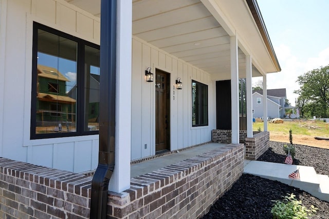 111 Legacy Way, Ward, AR 72176 - entrance to property featuring covered porch and board and batten siding