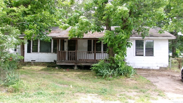 1321 Cherry Ln, Malvern, AR 72104 - view of front facade with covered porch, a shingled roof, and crawl space
