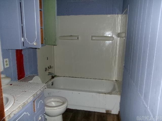 1321 Cherry Ln, Malvern, AR 72104 - bathroom featuring toilet, vanity, and tub / shower combination