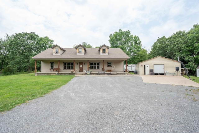 711 Batesville Mountain Rd, Damascus, AR 72039 - view of front of house with a detached garage, an outdoor structure, a front lawn, covered porch, and driveway