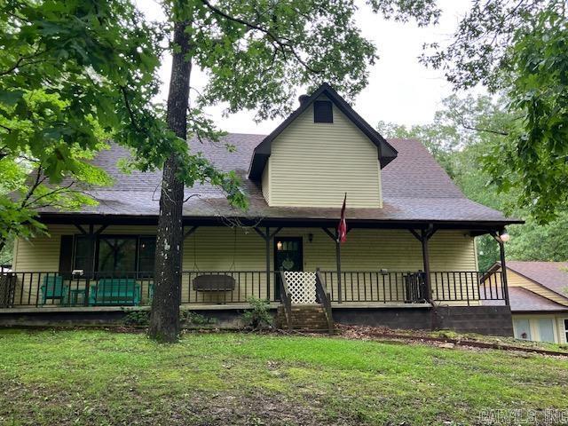 3244 Pyburn Ext, Pocahontas, AR 72455 - view of front of property featuring covered porch, a front lawn, and a shingled roof