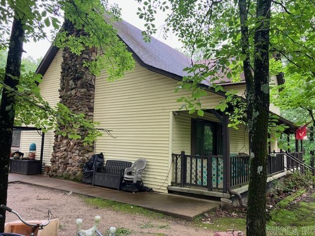 3244 Pyburn Ext, Pocahontas, AR 72455 - view of side of home featuring a porch and a shingled roof