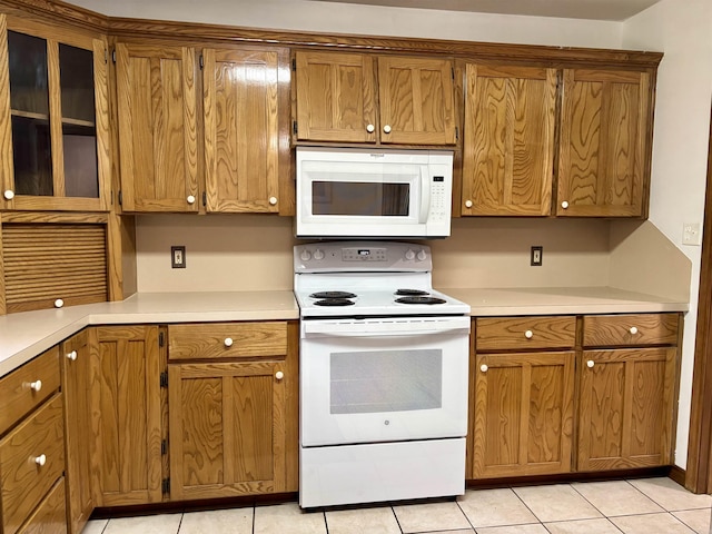 177 Timberlane, Dierks, AR 71833 - kitchen with white appliances, brown cabinets, and light countertops