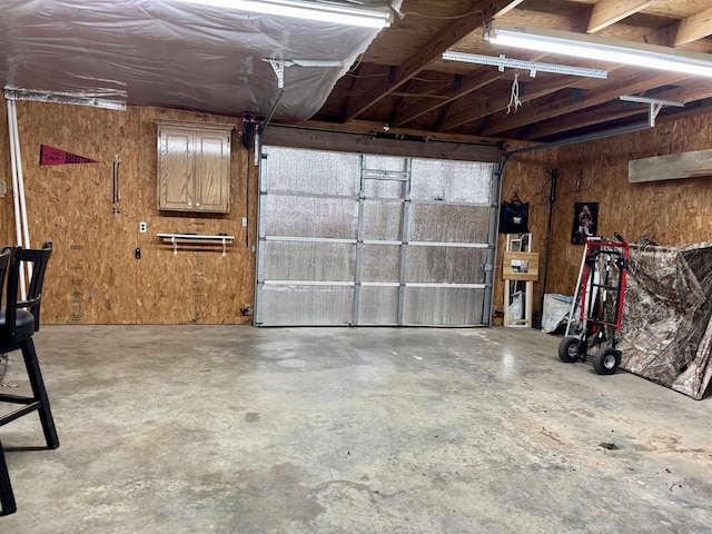 177 Timberlane, Dierks, AR 71833 - garage featuring wooden walls