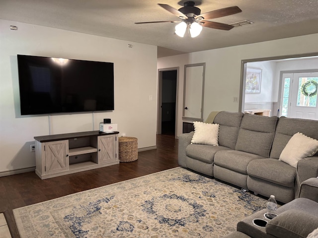 177 Timberlane, Dierks, AR 71833 - living room featuring a ceiling fan, dark wood-type flooring, and baseboards
