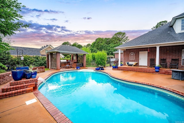 4545 Sawgrass Cv, Conway, AR 72034 - pool at dusk featuring a gazebo and a patio area