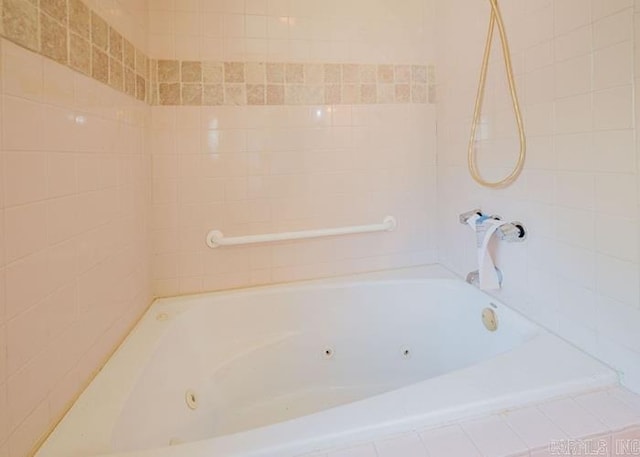 full bath with a combined bath / shower with jetted tub