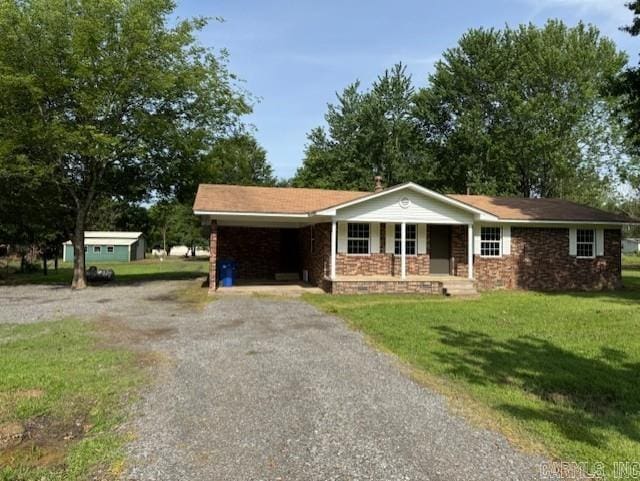 2275 Victory Ln, Conway, AR 72032 - ranch-style house with driveway, a porch, a front lawn, and an attached carport