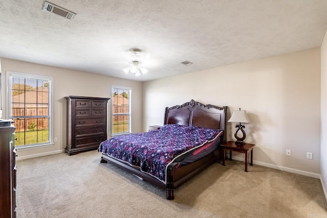 2960 Windamere Dr, Conway, AR 72034 - carpeted bedroom with baseboards and a textured ceiling