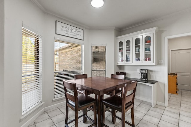 3720 Mcconnell Dr, Conway, AR 72034 - dining space featuring light tile patterned flooring, ornamental molding, and baseboards