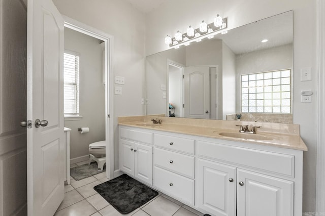3720 Mcconnell Dr, Conway, AR 72034 - full bath featuring double vanity, toilet, and tile patterned floors