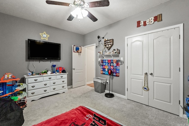 3720 Mcconnell Dr, Conway, AR 72034 - rec room with carpet flooring, ceiling fan, baseboards, and a textured ceiling