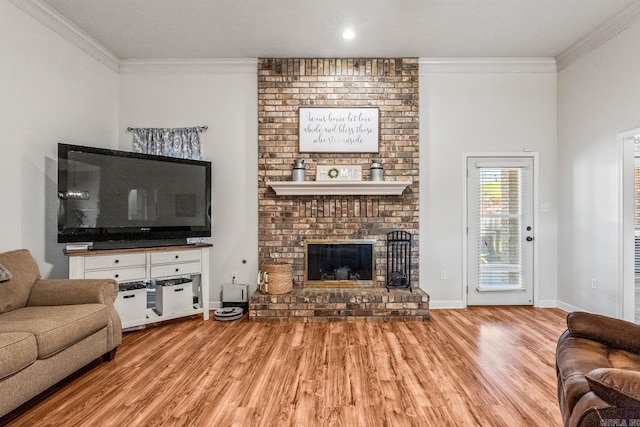 3720 Mcconnell Dr, Conway, AR 72034 - living area featuring ornamental molding, wood finished floors, a fireplace, and baseboards
