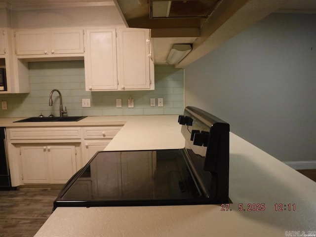 109 Indian Hls Unit C10, Hot Springs, AR 71913 - kitchen featuring a sink, white cabinets, light countertops, and decorative backsplash