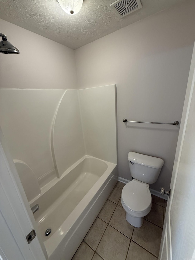 406 Apricot St, Austin, AR 72007 - bathroom with toilet, a shower, tile patterned floors, a textured ceiling, and a tub