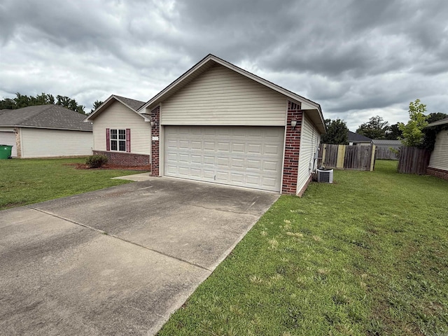 406 Apricot St, Austin, AR 72007 - view of front of home with brick siding, central AC unit, driveway, and an attached garage