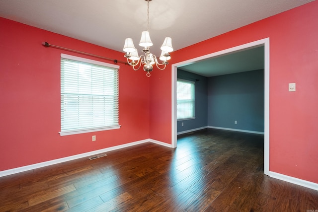 3400 Millbrook Rd, Little Rock, AR 72227 - spare room with a chandelier, baseboards, and wood finished floors