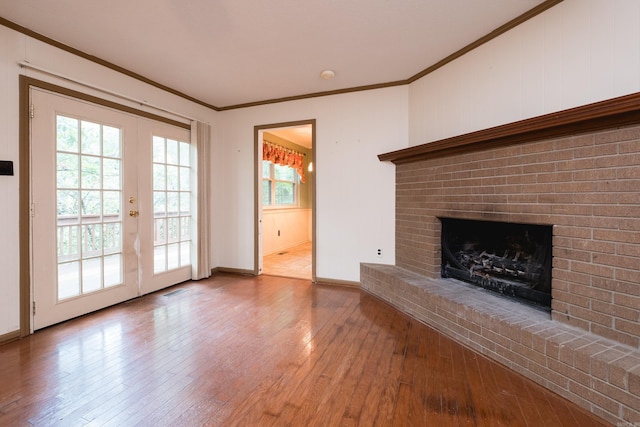 3400 Millbrook Rd, Little Rock, AR 72227 - unfurnished living room featuring hardwood / wood-style flooring, french doors, crown molding, a fireplace, and baseboards