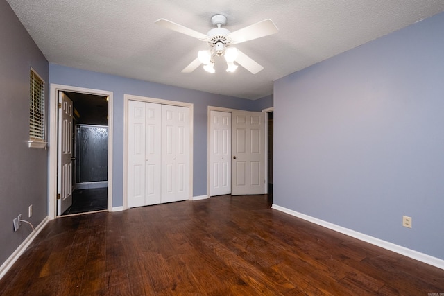 3400 Millbrook Rd, Little Rock, AR 72227 - unfurnished bedroom featuring wood finished floors, baseboards, two closets, connected bathroom, and ceiling fan