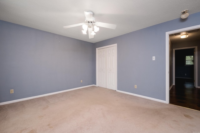 3400 Millbrook Rd, Little Rock, AR 72227 - unfurnished bedroom featuring carpet floors, a closet, baseboards, and a ceiling fan