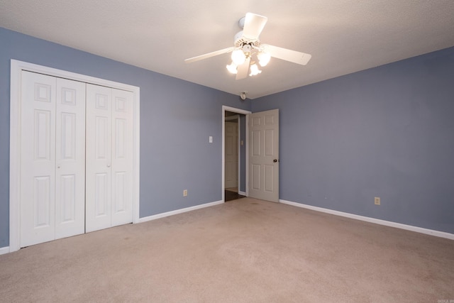 3400 Millbrook Rd, Little Rock, AR 72227 - unfurnished bedroom featuring carpet flooring, baseboards, a closet, and a ceiling fan