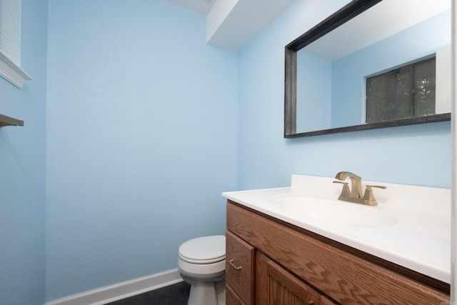 3400 Millbrook Rd, Little Rock, AR 72227 - bathroom with vanity, toilet, baseboards, and tile patterned flooring