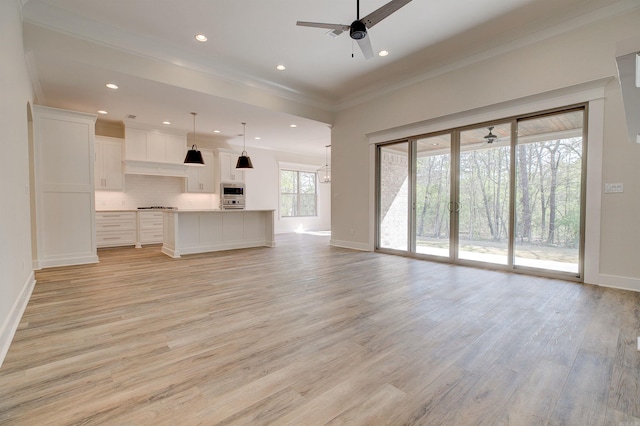 9 Quartz Cv, Little Rock, AR 72223 - unfurnished living room with a ceiling fan, ornamental molding, baseboards, light wood-style flooring, and recessed lighting