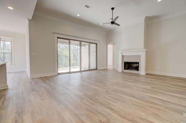 9 Quartz Cv, Little Rock, AR 72223 - unfurnished living room with ceiling fan, healthy amount of natural light, a fireplace, crown molding, and light wood-style flooring