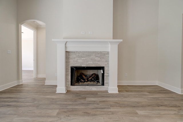 9 Quartz Cv, Little Rock, AR 72223 - detailed view of a fireplace, wood finished floors, and baseboards