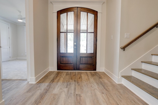 9 Quartz Cv, Little Rock, AR 72223 - foyer entrance with wood finished floors, baseboards, french doors, and stairway