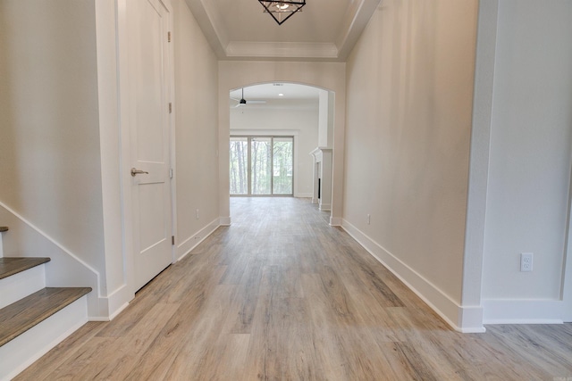 9 Quartz Cv, Little Rock, AR 72223 - hallway with arched walkways, wood finished floors, crown molding, baseboards, and stairway