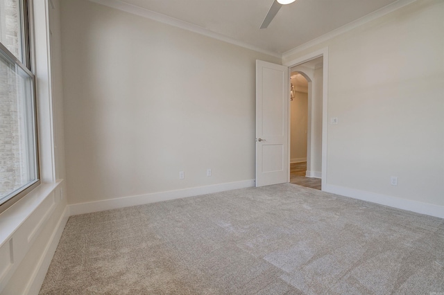 9 Quartz Cv, Little Rock, AR 72223 - spare room with arched walkways, carpet floors, ceiling fan, crown molding, and baseboards
