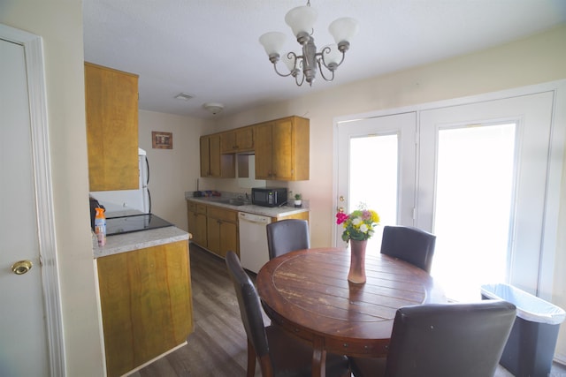 dining area featuring a chandelier and wood finished floors