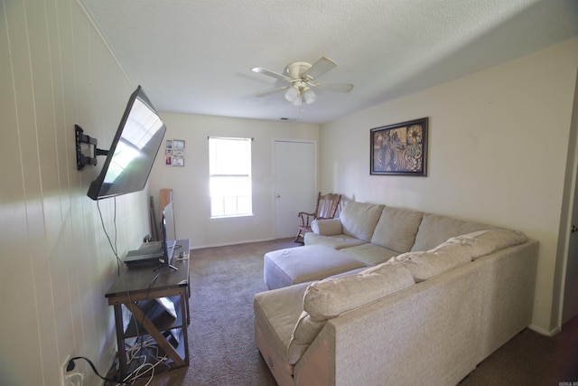 living room with carpet flooring, ceiling fan, and baseboards