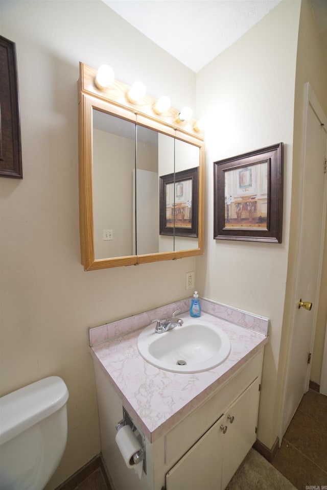 half bath with vanity and toilet