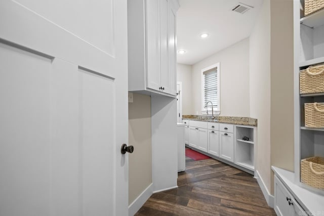 1125 Lisa Ln, Conway, AR 72034 - laundry area featuring a sink, dark wood-style flooring, recessed lighting, and baseboards