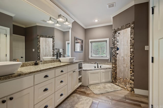1125 Lisa Ln, Conway, AR 72034 - full bath featuring a garden tub, crown molding, tiled shower, double vanity, and wood finished floors