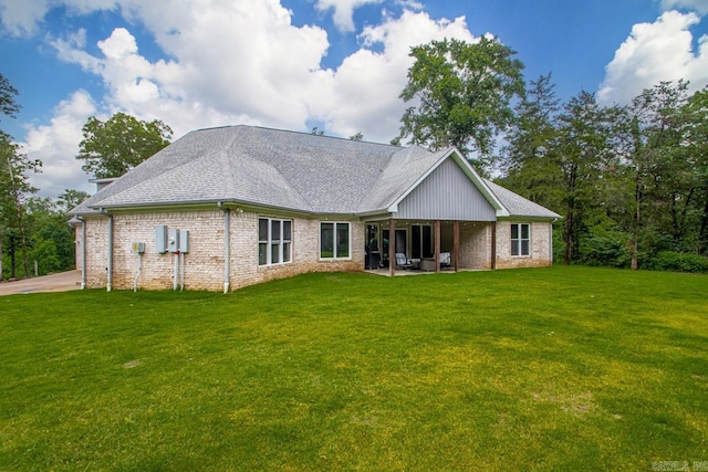 1125 Lisa Ln, Conway, AR 72034 - back of house with a lawn, brick siding, and a shingled roof