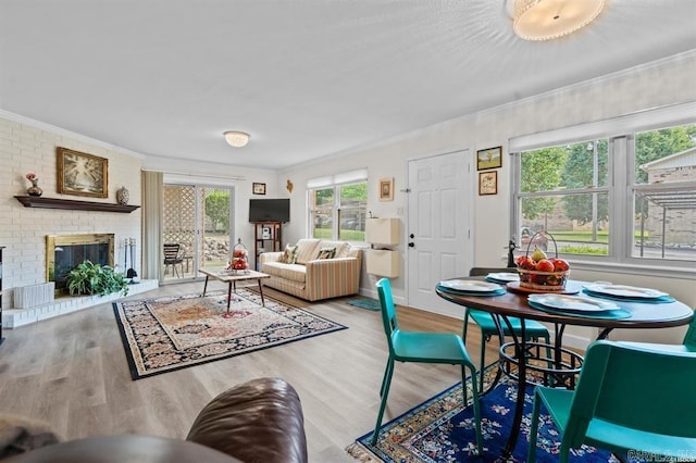160 Cooper St Unit B11, Hot Springs, AR 71913 - living room with wood finished floors, crown molding, and a brick fireplace