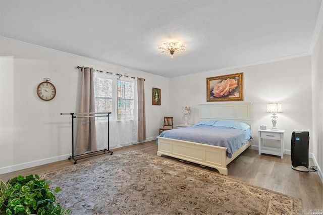 160 Cooper St Unit B11, Hot Springs, AR 71913 - bedroom with light wood-type flooring, baseboards, and crown molding