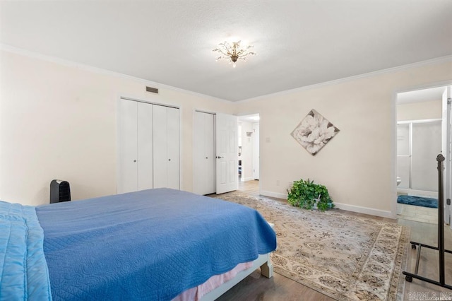 160 Cooper St Unit B11, Hot Springs, AR 71913 - bedroom featuring multiple closets, ornamental molding, baseboards, and ensuite bath