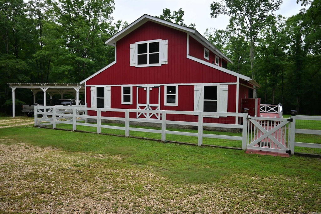94 Grant 3511, Sheridan, AR 72150 - view of front of house with a barn, an outdoor structure, a carport, and a gate