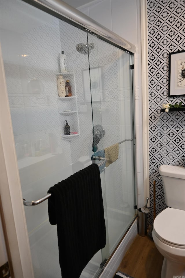 20 Ridgeway Dr, Sheridan, AR 72150 - bathroom featuring toilet, a stall shower, and wood finished floors