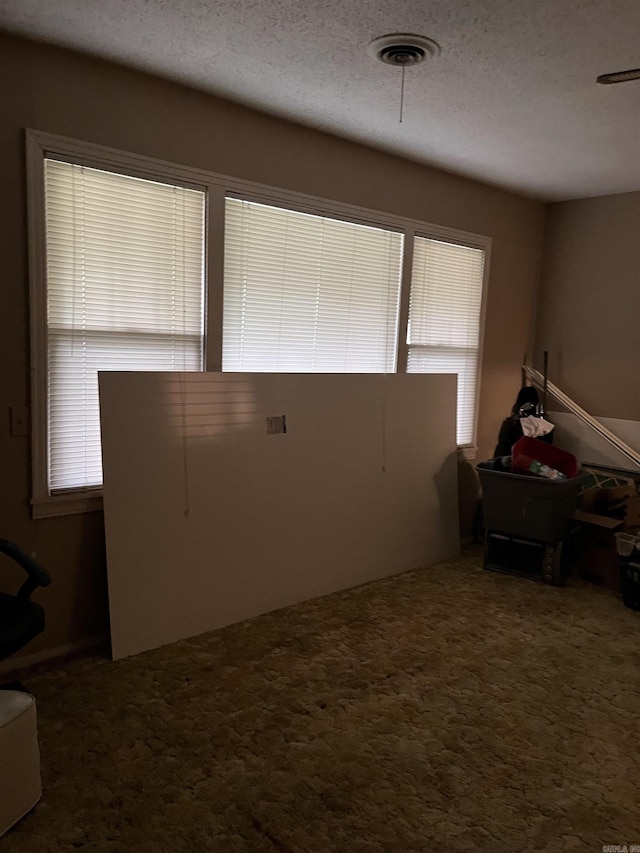 720 Depot St, Lonoke, AR 72086 - carpeted bedroom with a textured ceiling
