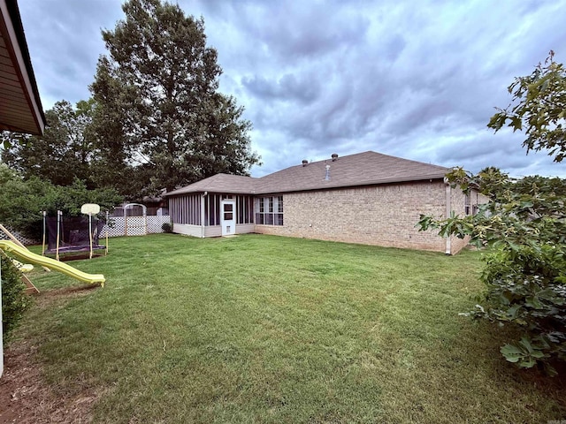 7 Butterfly Dr, Sherwood, AR 72120 - view of green lawn featuring a sunroom