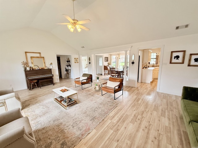 7 Butterfly Dr, Sherwood, AR 72120 - living area with light wood-style floors, ceiling fan, lofted ceiling, french doors, and baseboards