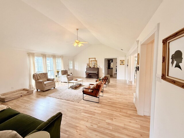 7 Butterfly Dr, Sherwood, AR 72120 - living area with a ceiling fan, light wood-style floors, lofted ceiling, and baseboards