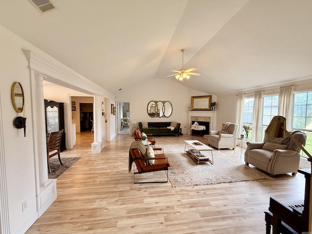 7 Butterfly Dr, Sherwood, AR 72120 - living area with ceiling fan, lofted ceiling, a fireplace, and light wood-style floors