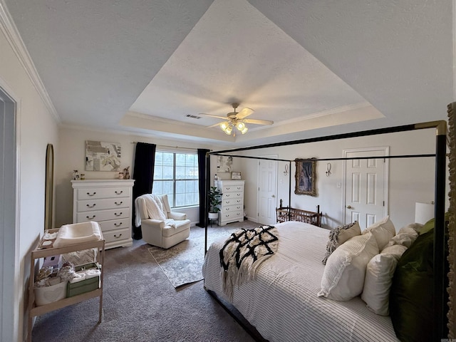 7 Butterfly Dr, Sherwood, AR 72120 - bedroom featuring a raised ceiling, carpet, ornamental molding, ceiling fan, and a textured ceiling